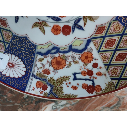 2034 - Oriental ceramic plate with floral design {31 cm Dia.}.