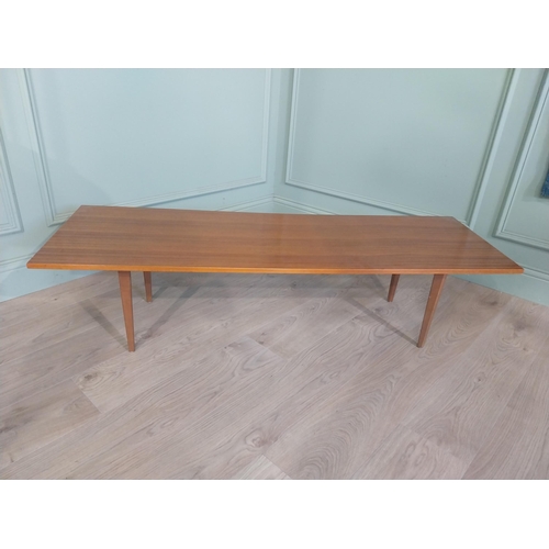 2035 - Mid Century teak coffee table on square tapered legs. {34 cm H x 138 cm W x 46 cm D}.