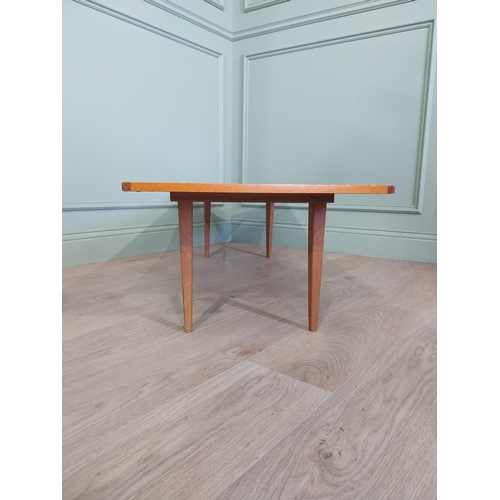 2035 - Mid Century teak coffee table on square tapered legs. {34 cm H x 138 cm W x 46 cm D}.