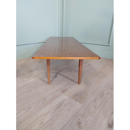 2035 - Mid Century teak coffee table on square tapered legs. {34 cm H x 138 cm W x 46 cm D}.