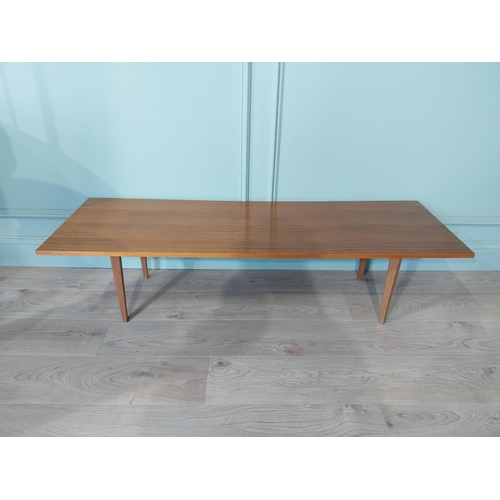 2035 - Mid Century teak coffee table on square tapered legs. {34 cm H x 138 cm W x 46 cm D}.