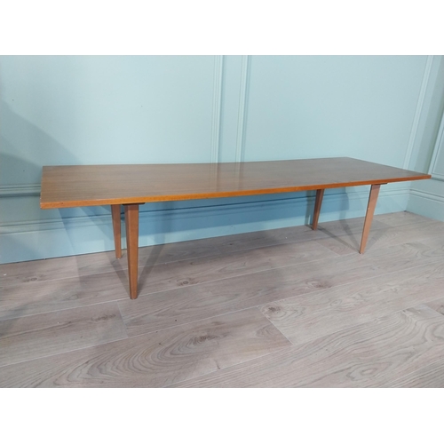 2035 - Mid Century teak coffee table on square tapered legs. {34 cm H x 138 cm W x 46 cm D}.