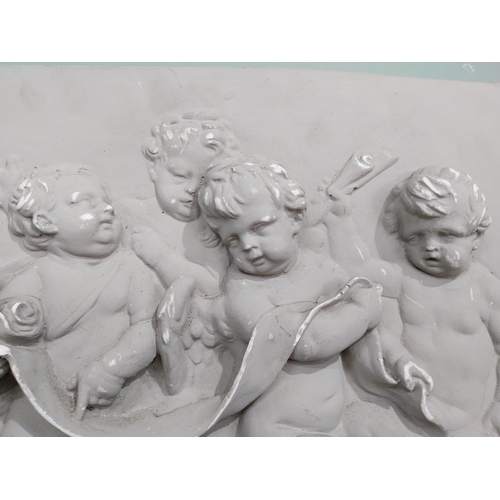 2049 - Decorative plaster wall plaque depicting Cherubs {38 cm H x 49 cm W}.