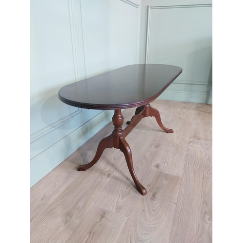 2054 - Mahogany coffee table, raised on turned supports and single stretcher. { 53cm H X 114cm W X 46cm D }... 