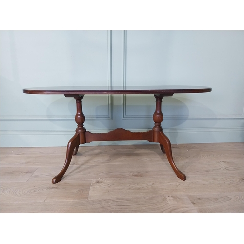 2054 - Mahogany coffee table, raised on turned supports and single stretcher. { 53cm H X 114cm W X 46cm D }... 