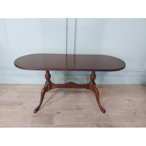 2054 - Mahogany coffee table, raised on turned supports and single stretcher. { 53cm H X 114cm W X 46cm D }... 