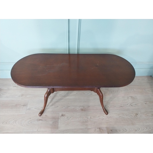 2054 - Mahogany coffee table, raised on turned supports and single stretcher. { 53cm H X 114cm W X 46cm D }... 