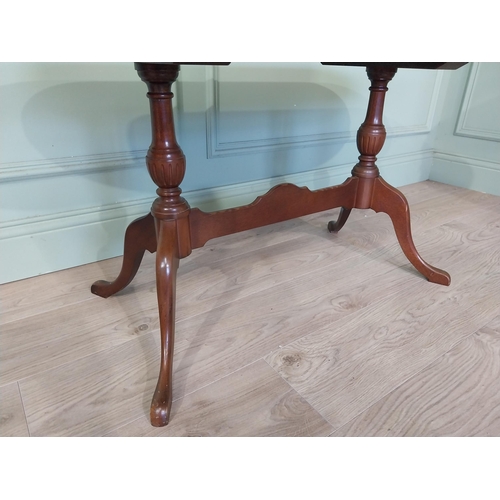 2054 - Mahogany coffee table, raised on turned supports and single stretcher. { 53cm H X 114cm W X 46cm D }... 