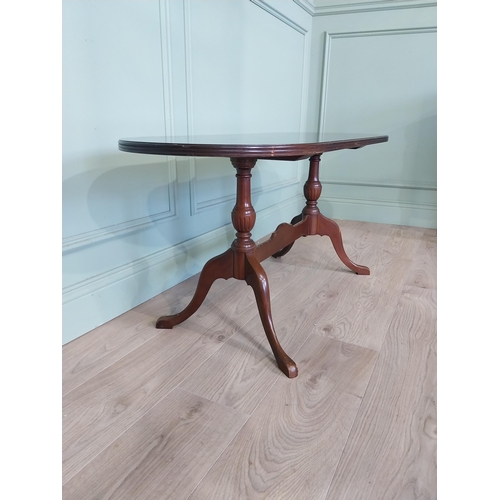 2054 - Mahogany coffee table, raised on turned supports and single stretcher. { 53cm H X 114cm W X 46cm D }... 