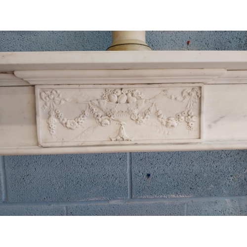 742 - Irish Georgian marble fire surround with central carved plaque depicting urns, rosettes, fruit and w... 