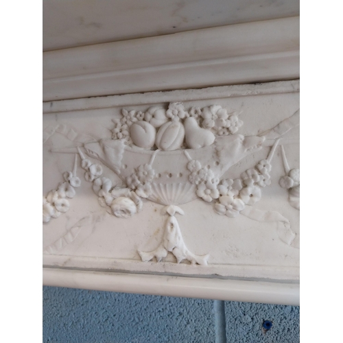 742 - Irish Georgian marble fire surround with central carved plaque depicting urns, rosettes, fruit and w... 