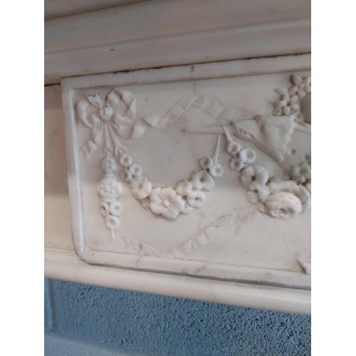 742 - Irish Georgian marble fire surround with central carved plaque depicting urns, rosettes, fruit and w... 