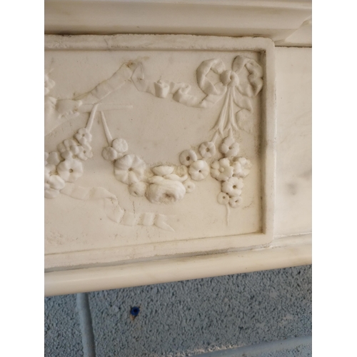 742 - Irish Georgian marble fire surround with central carved plaque depicting urns, rosettes, fruit and w... 