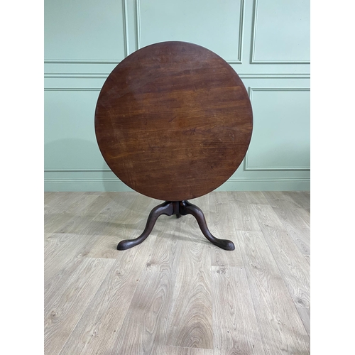 1117 - Irish Georgian mahogany tilt top super table raised on bird cage and gun barrel column and three out... 