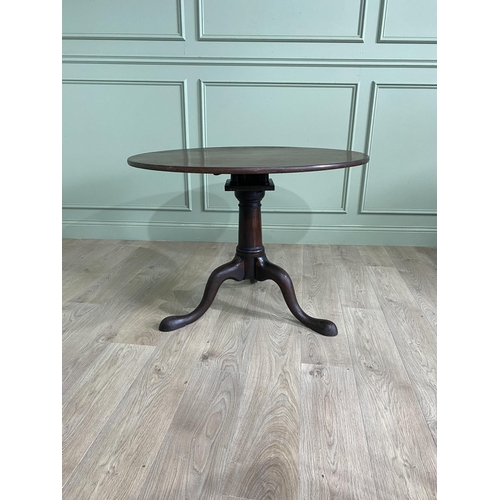 1117 - Irish Georgian mahogany tilt top super table raised on bird cage and gun barrel column and three out... 