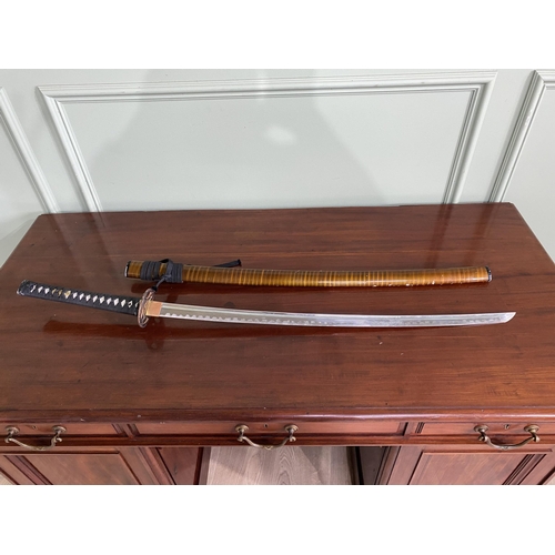 1182 - Samurai sword with scabbard {105 cm H}.