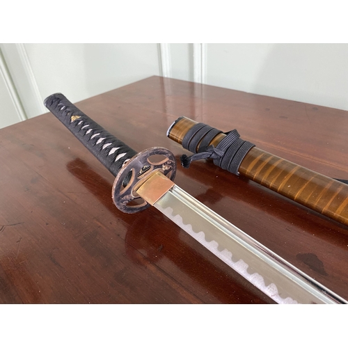 1182 - Samurai sword with scabbard {105 cm H}.