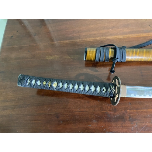 1182 - Samurai sword with scabbard {105 cm H}.