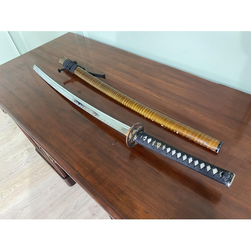 1182 - Samurai sword with scabbard {105 cm H}.