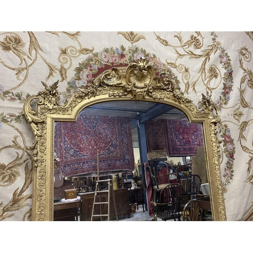 125 - 19th C. French decorative giltwood over mantle mirror {210 cm H x 143 cm W}.