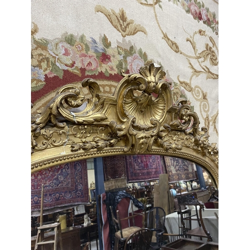 125 - 19th C. French decorative giltwood over mantle mirror {210 cm H x 143 cm W}.