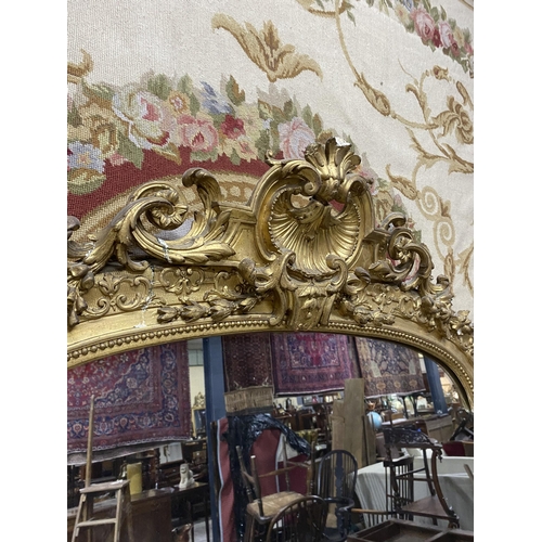 125 - 19th C. French decorative giltwood over mantle mirror {210 cm H x 143 cm W}.