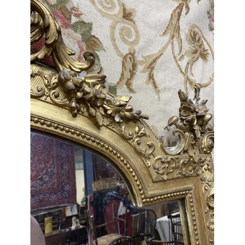 125 - 19th C. French decorative giltwood over mantle mirror {210 cm H x 143 cm W}.