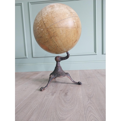 1252 - Early 20th C. world globe on decorative cast iron stand {72 cm H x 40 cm Dia.}.