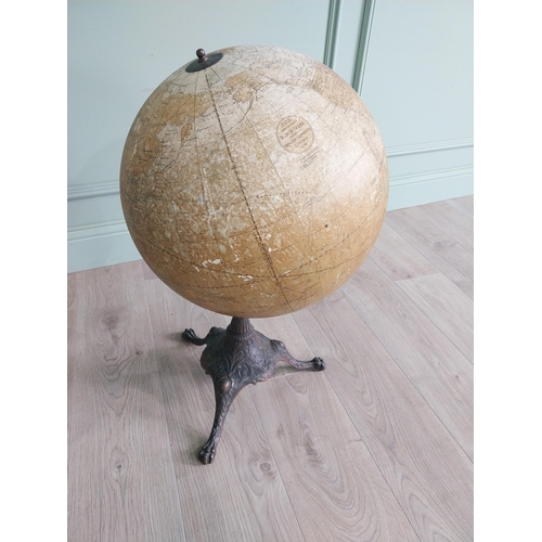 1252 - Early 20th C. world globe on decorative cast iron stand {72 cm H x 40 cm Dia.}.