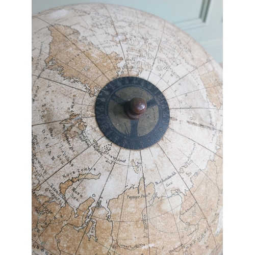 1252 - Early 20th C. world globe on decorative cast iron stand {72 cm H x 40 cm Dia.}.