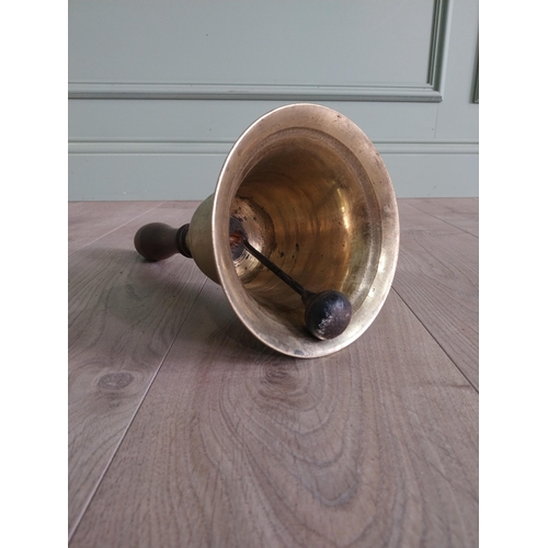 1383 - Good quality early 20th C. brass hand bell with mahogany handle {33 cm H x 16 cm Dia.}.