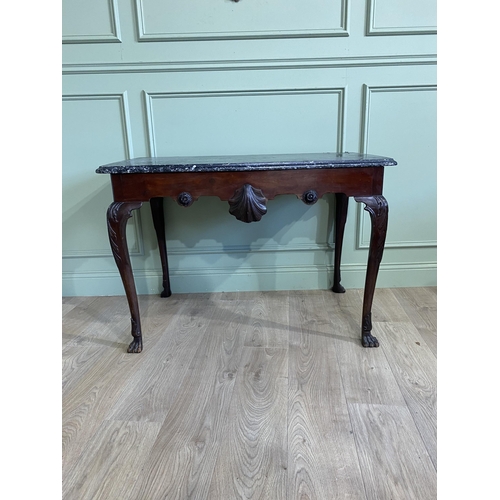 168 - Fine Irish 18th C. Georgian mahogany side table with marble top and the apron centred by shell raise... 