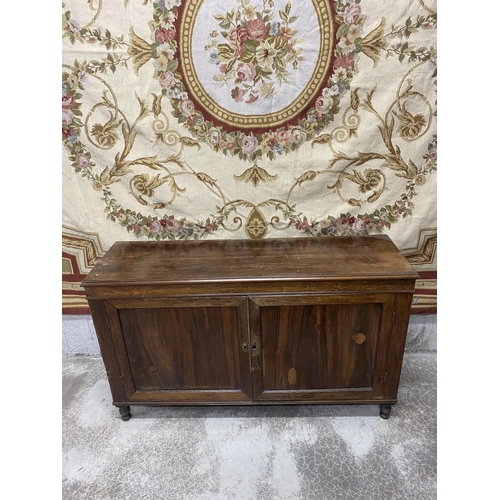 565 - 19th C. rosewood two door side cabinet raised on turned feet {86 cm H x 144 cm W x 44 cm D}.