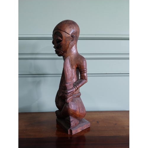 659 - Carved hardwood African figure {64 cm H x 16 cm W x 15 cm D}.