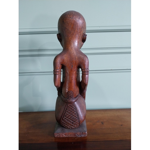 659 - Carved hardwood African figure {64 cm H x 16 cm W x 15 cm D}.