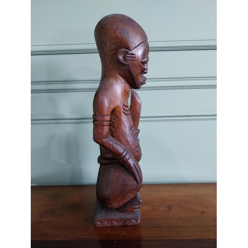 659 - Carved hardwood African figure {64 cm H x 16 cm W x 15 cm D}.