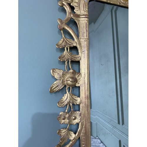 675 - Irish 18th C. Georgian flatly carved giltwood pier mirror composed of C-scrolls surmounted by a bask... 