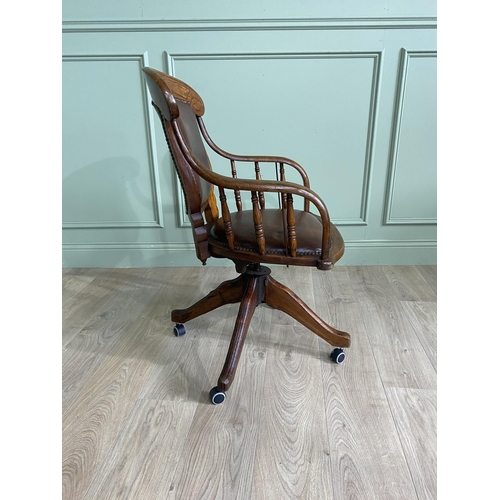 867 - Edwardian oak revolving office chair with leather upholstered seat {91 cm H x 56 cm W x 62 cm D}.