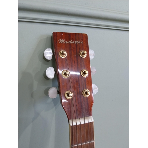 2063 - Manhattan six string acoustic guitar {105 cm H x 44 cm W x 13 cm D}.