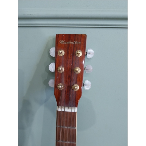 2063 - Manhattan six string acoustic guitar {105 cm H x 44 cm W x 13 cm D}.