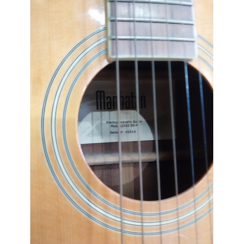 2063 - Manhattan six string acoustic guitar {105 cm H x 44 cm W x 13 cm D}.