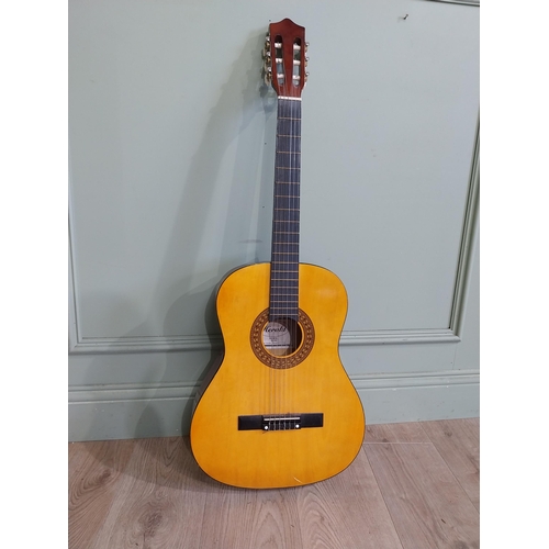 2064 - Herald Model No. HL44 acoustic guitar {101 cm H x 38 cm W x 10 cm D}.