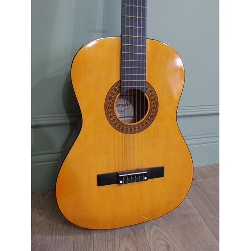 2064 - Herald Model No. HL44 acoustic guitar {101 cm H x 38 cm W x 10 cm D}.