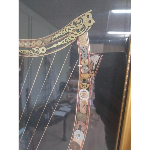 2072 - The Great Irish Harp by John Ammon 1918 mounted in gilt frame made from clock and watch parts {82 cm... 