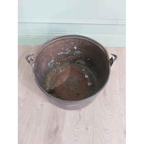 2075 - Early 20th C. copper and brass log bucket with wrought iron handle {53 cm H x 50 cm Dia.}.