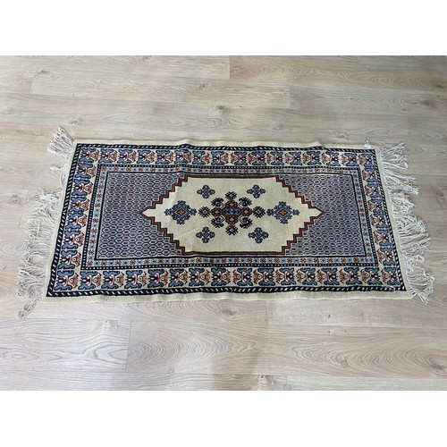 2083 - Pair of decorative rugs {145 cm L x 80 cm W}.