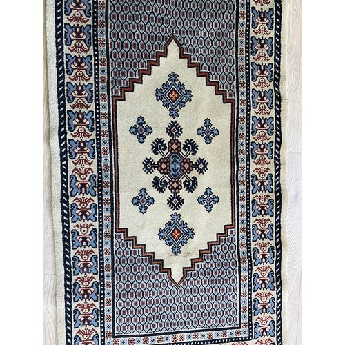 2083 - Pair of decorative rugs {145 cm L x 80 cm W}.