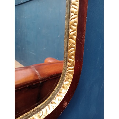 575 - Mahogany framed wall mirror with gilded inner border, featuring an elaborately carved pediment {H 87... 