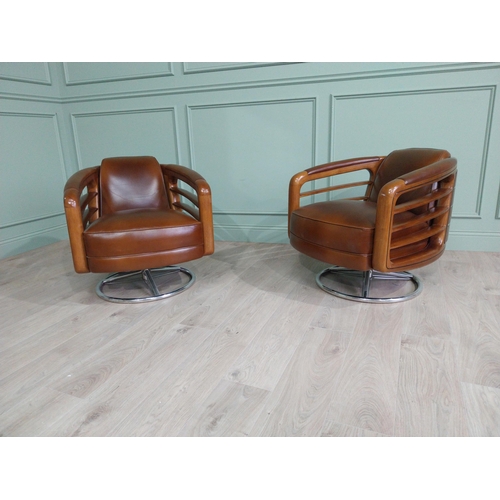 644 - Pair exceptional quality cherrywood and hand dyed leather swivel arm chairs on chrome bases in the M... 