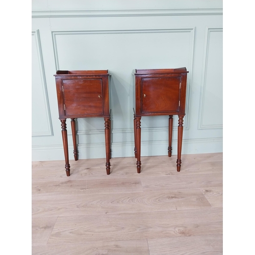 1051 - Pair of mahogany pot cupboards with single door raised on tapered legs {78 cm H x 37 cm W x 34 cm D}... 